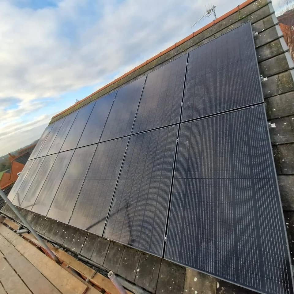 Solar panel installation on a tiled roof completed by JP Bobcat Roofing, Warwickshire