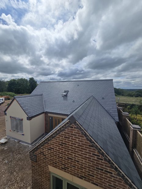 Completed Spanish slate roof on a large new-build bungalow in Barby, Warwickshire