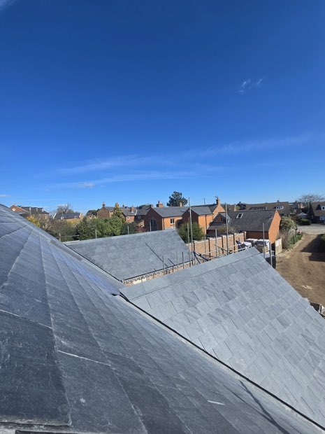Spanish slate roof slopes on a new-build bungalow in Barby, Warwickshire
