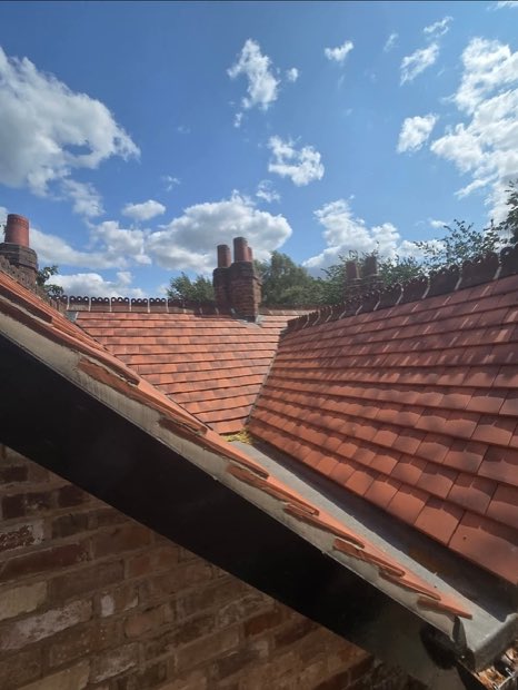 Ornamental ridge tiles and a lead-lined valley on a re-roofed period house in Uttoxeter