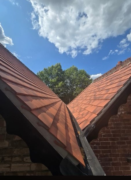 Hand-cut swept valley detail in new roof tiles on a period property in Uttoxeter, Staffordshire