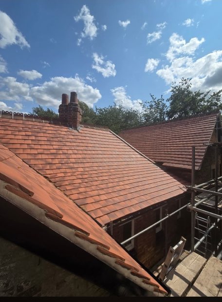 Long runs of new Sandtoft 2020 tiles across the main roof elevation in Uttoxeter, Staffordshire
